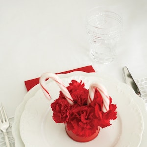 A white and red Christmas table setting
