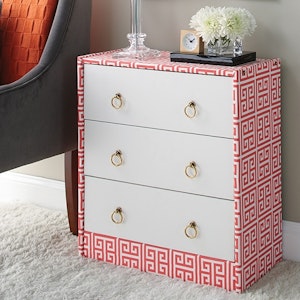 DIY upgrade of an IKEA Rast dresser with fabric covering and new drawer pulls
