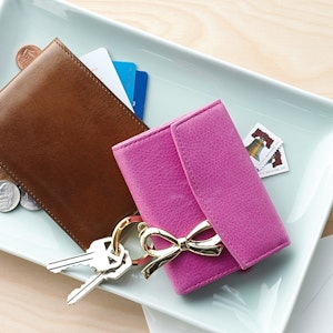 Wallets, keys, and change are collected on a catch-all plate
