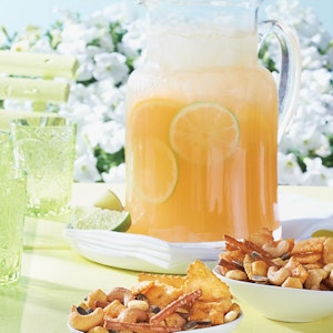 Bowls of Smoky Snax are served with a pitcher of Mango-Orange Seltzer
