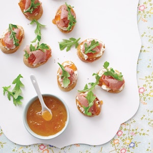 Serve Savory Apricot Crostini as an appetizer on a toasted baguette slice topped with feathery arugula sprigs.
