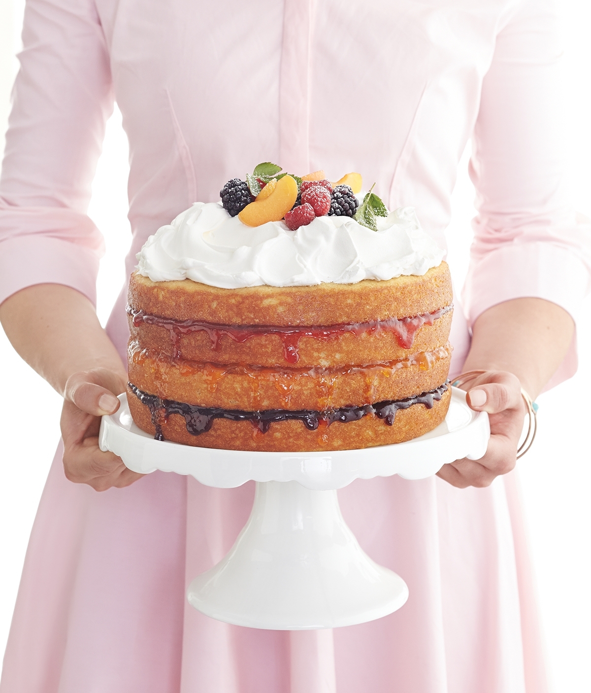 The right ratio of almond extract to lemon peel sets a luscious stage for a triple sampling of jams and a crown of whipped cream.
